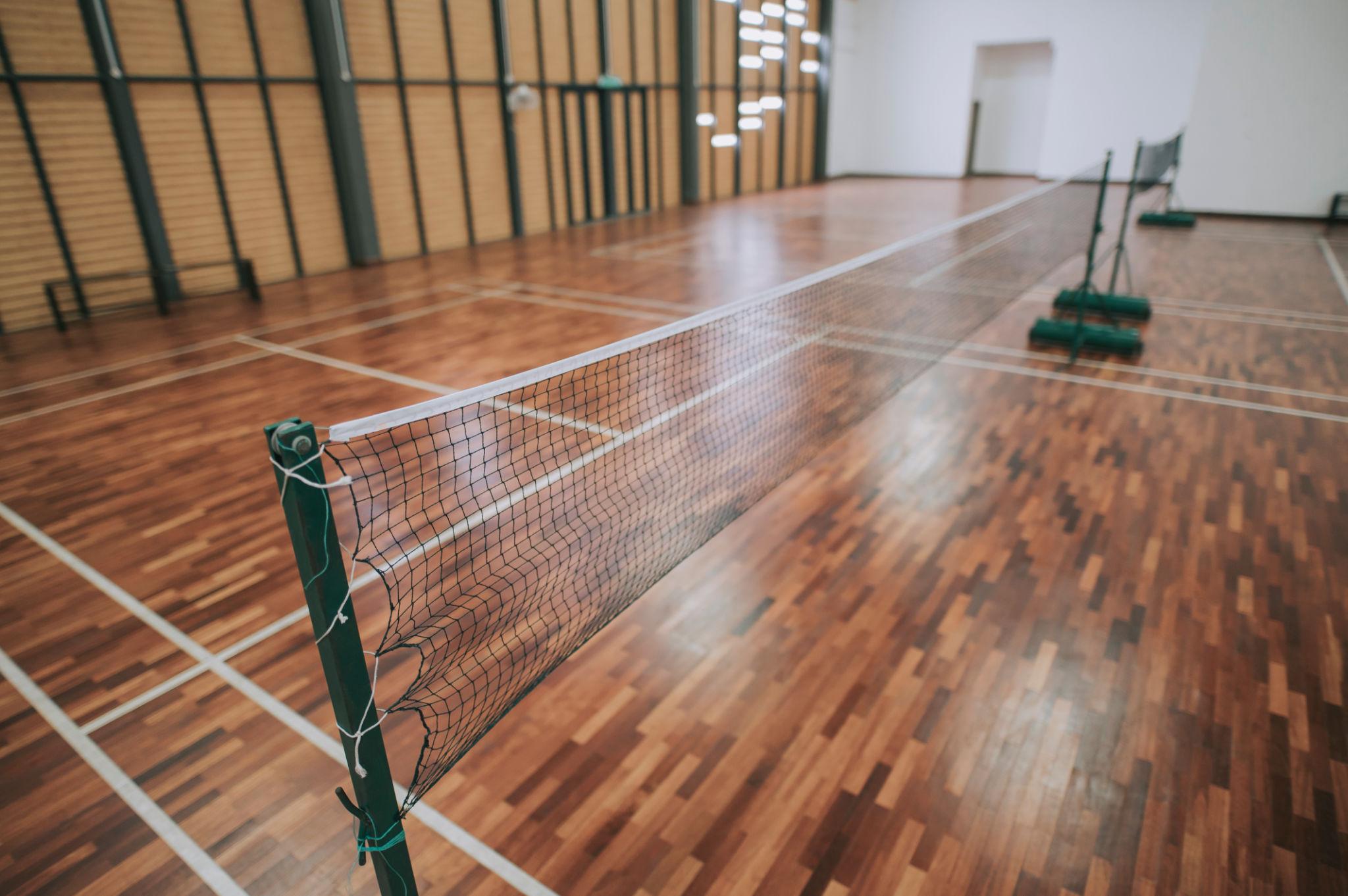 Indoor badminton courts prepared for team training